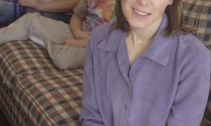 žena
