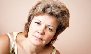 žena